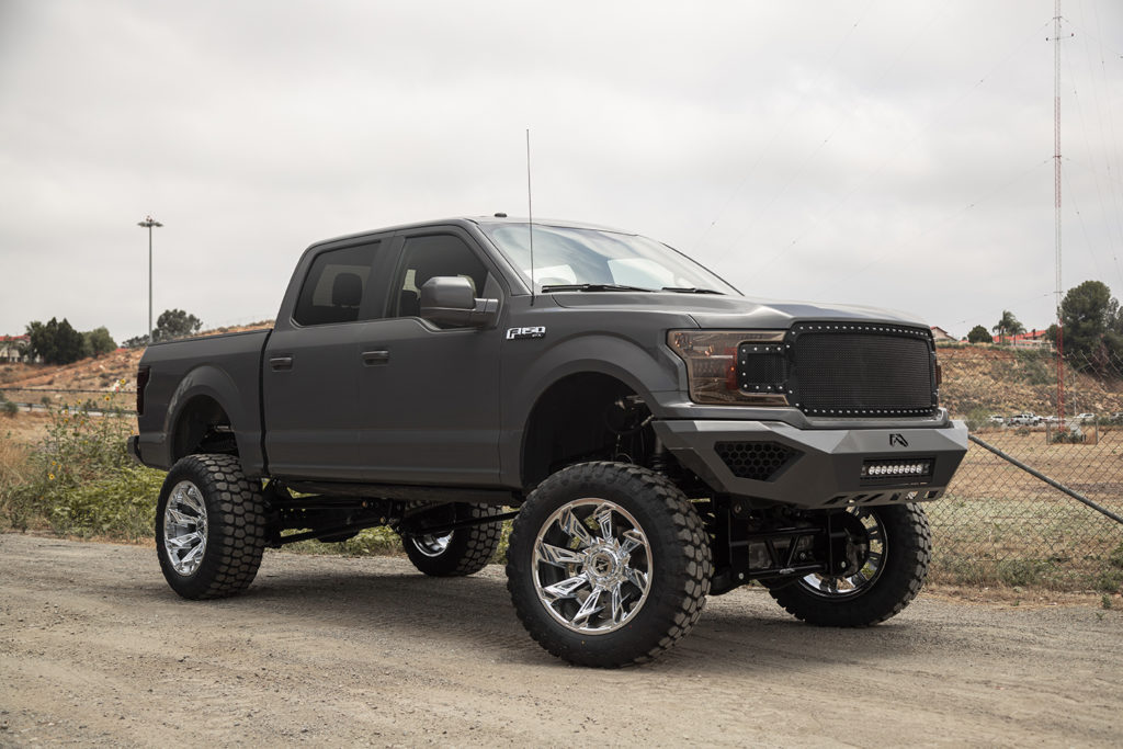 Gray Ford F150 on Road with Chrome Truck Wheels